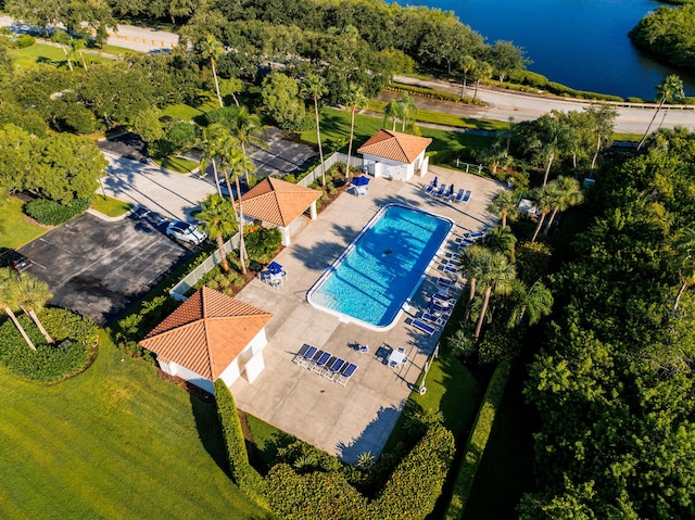 aerial view of a pool and a large body of water