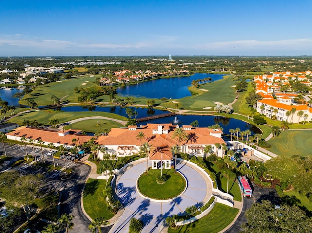 aerial view of residential area with a local golf course and a large body of water