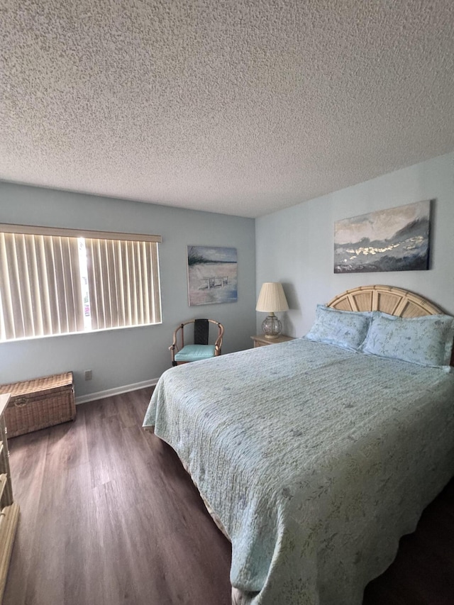 326 Knotty Pine Cir Unit C-2, Greenacres, FL 33463 - bedroom featuring wood finished floors, a textured ceiling, and baseboards