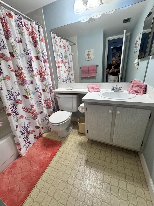 326 Knotty Pine Cir Unit C-2, Greenacres, FL 33463 - bathroom featuring tile patterned floors, toilet, vanity, and shower / bath combo with shower curtain