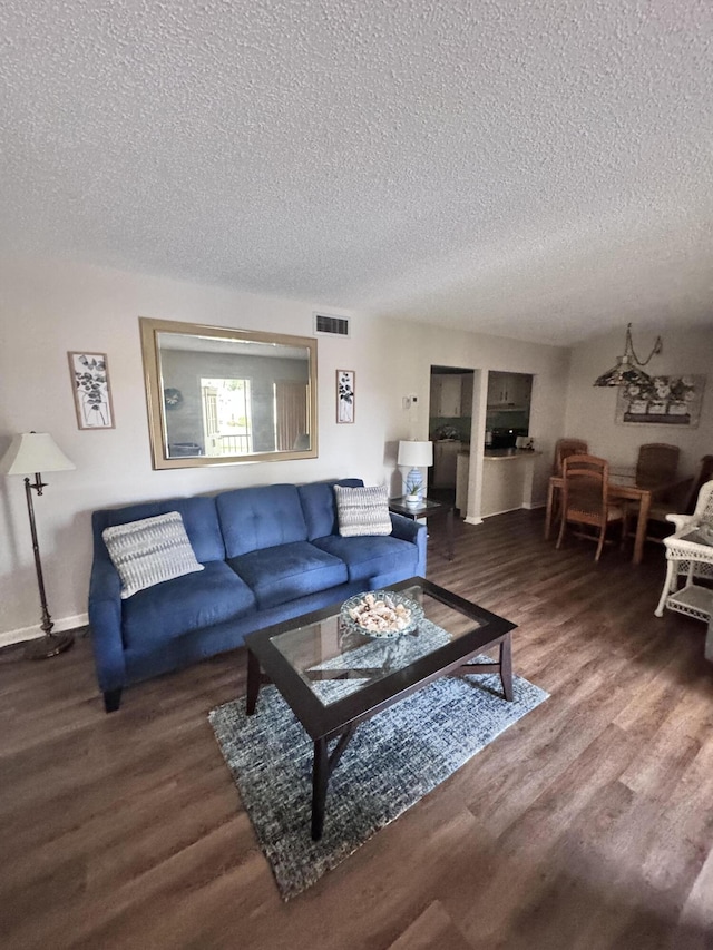 326 Knotty Pine Cir Unit C-2, Greenacres, FL 33463 - living room with a textured ceiling, wood finished floors, and baseboards