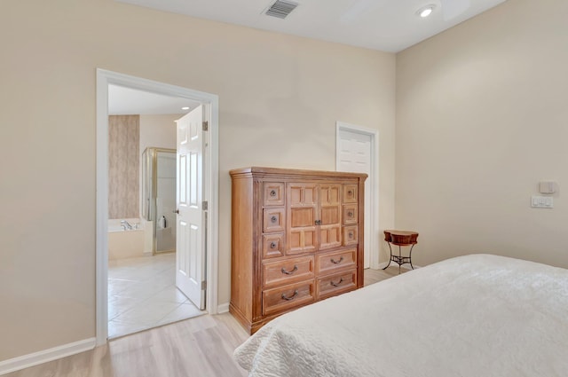 bedroom featuring light wood-style flooring, baseboards, connected bathroom, and recessed lighting
