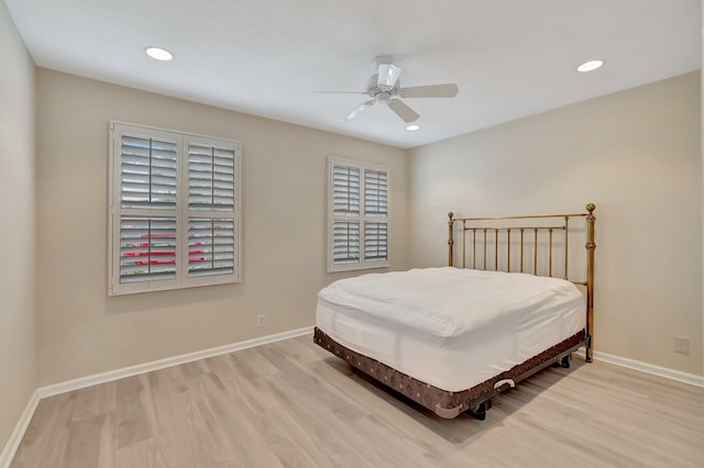 bedroom featuring wood finished floors, baseboards, recessed lighting, and ceiling fan