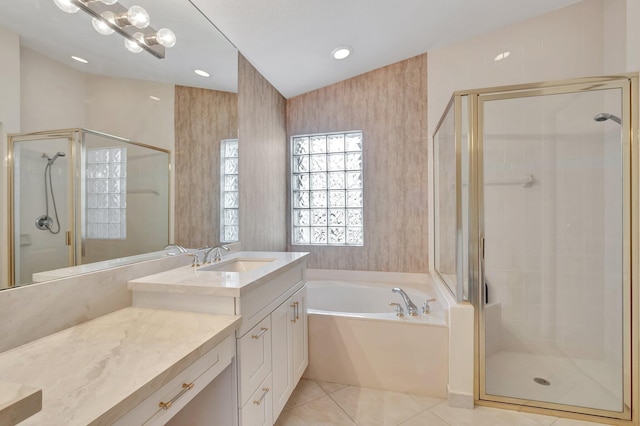 full bath with a stall shower, a garden tub, vanity, and tile patterned floors