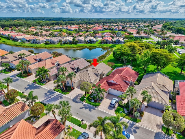 aerial perspective of suburban area with a nearby body of water