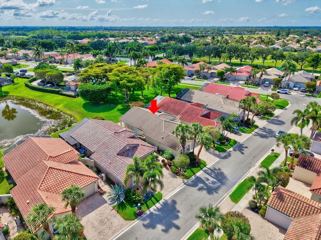 aerial perspective of suburban area with a nearby body of water