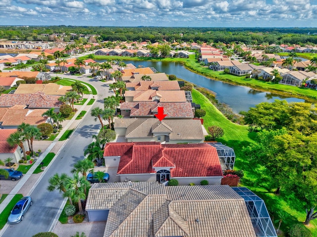 aerial view of residential area featuring a nearby body of water