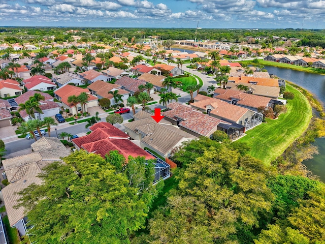 aerial view of residential area with a nearby body of water