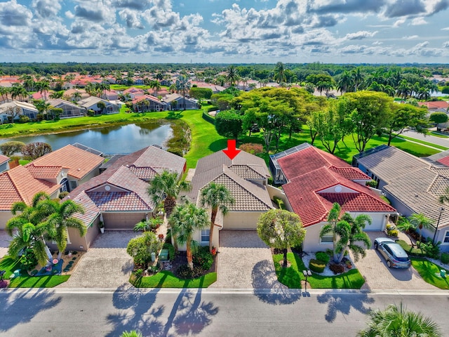 aerial perspective of suburban area featuring a nearby body of water