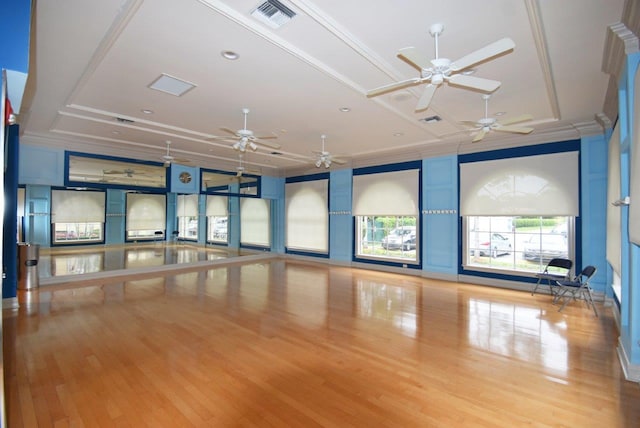 unfurnished room featuring crown molding, wood finished floors, and ceiling fan