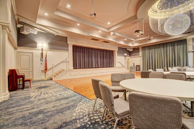building lobby with stairway, a decorative wall, and recessed lighting