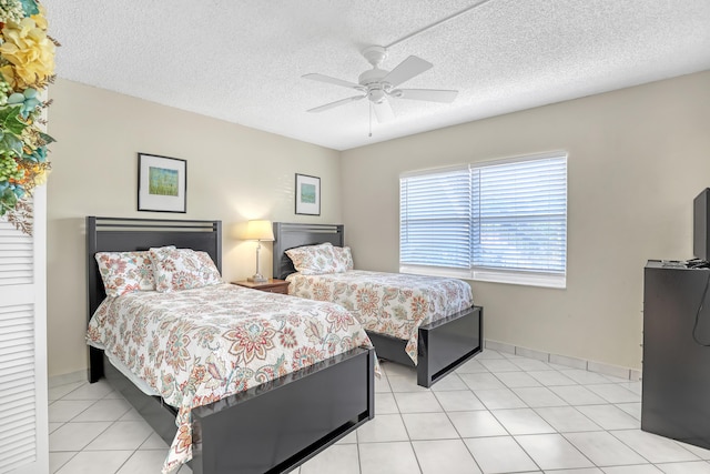 13446 Sabal Palm Ct Unit A, Delray Beach, FL 33484 - bedroom with a textured ceiling, a ceiling fan, baseboards, and light tile patterned floors