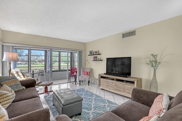 13446 Sabal Palm Ct Unit A, Delray Beach, FL 33484 - living room with light tile patterned floors and a textured ceiling