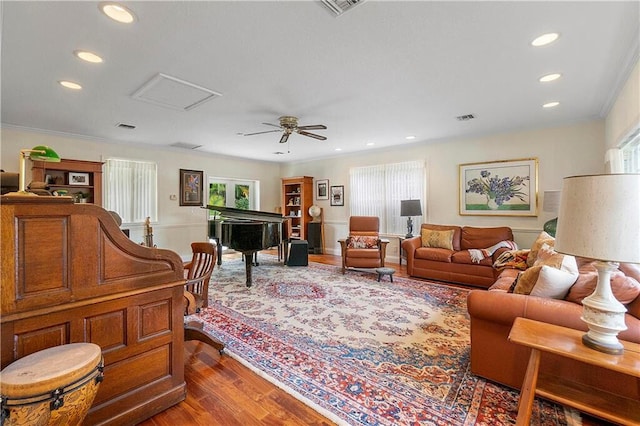 living room with dark wood-style floors, recessed lighting, crown molding, and a ceiling fan