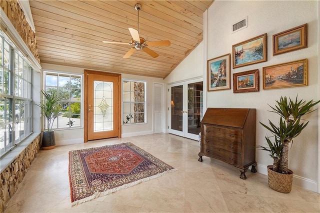 foyer featuring french doors, wooden ceiling, lofted ceiling, ceiling fan, and baseboards