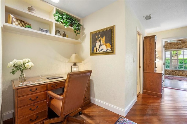 office with dark wood-type flooring and baseboards