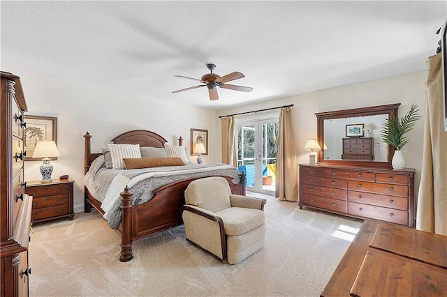 bedroom featuring access to exterior, light carpet, and a ceiling fan