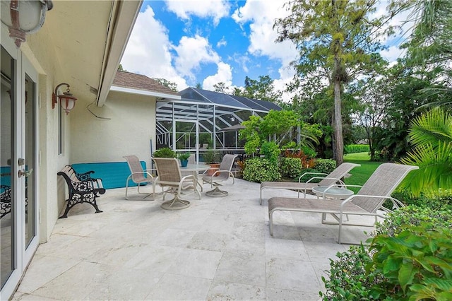 view of patio with a lanai