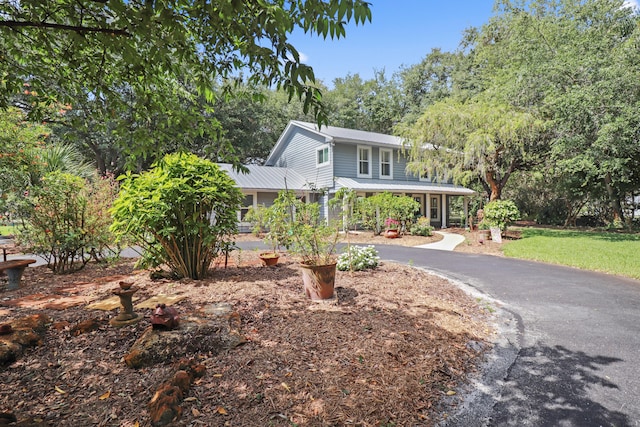 2414 SW Love Ct, Palm City, FL 34990 - view of front of property featuring asphalt driveway