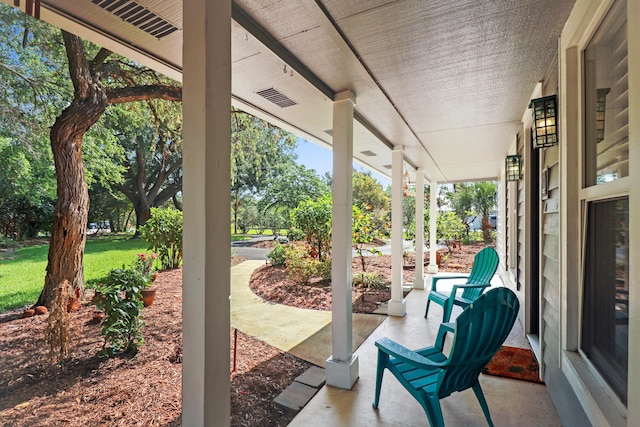 2414 SW Love Ct, Palm City, FL 34990 - view of patio featuring covered porch