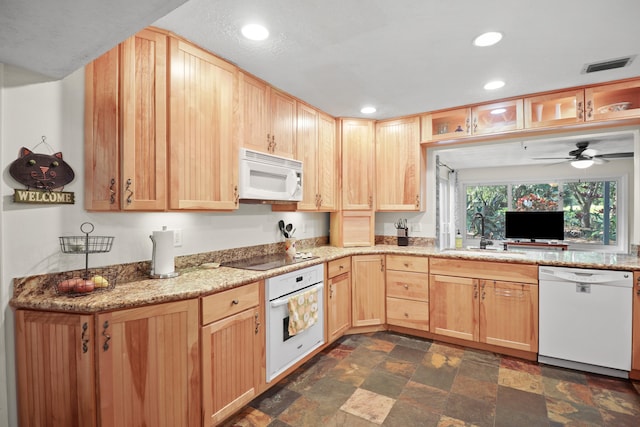 2414 SW Love Ct, Palm City, FL 34990 - kitchen with white appliances, light brown cabinetry, a sink, dark stone finish flooring, and recessed lighting