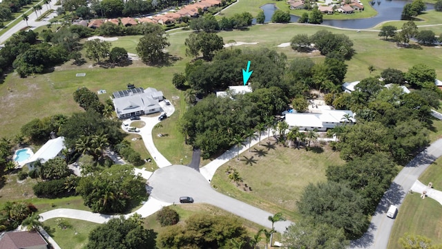 2414 SW Love Ct, Palm City, FL 34990 - aerial view of property's location with a nearby body of water, a golf course, and nearby suburban area