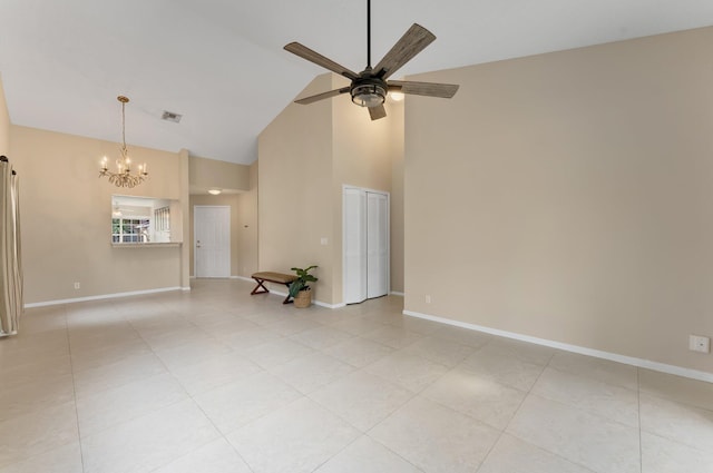 6616 Marissa Cir, Lake Worth, FL 33467 - spare room featuring high vaulted ceiling, ceiling fan, a chandelier, baseboards, and light tile patterned floors