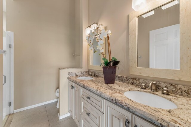 6616 Marissa Cir, Lake Worth, FL 33467 - bathroom with toilet, tile patterned floors, a stall shower, double vanity, and baseboards