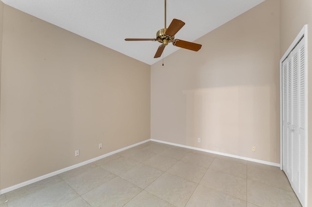 6616 Marissa Cir, Lake Worth, FL 33467 - unfurnished bedroom with high vaulted ceiling, light tile patterned floors, baseboards, a closet, and ceiling fan