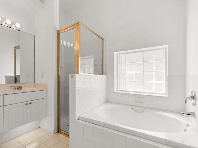 bathroom with vanity, a garden tub, tile patterned flooring, and a shower stall
