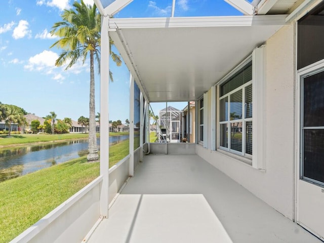 view of patio / terrace with a water view and a residential view