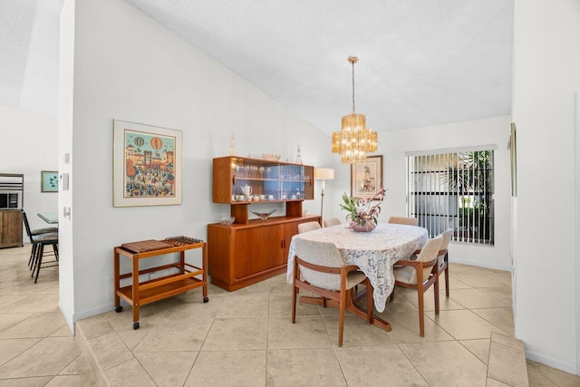 dining space featuring lofted ceiling, a chandelier, light tile patterned flooring, and baseboards