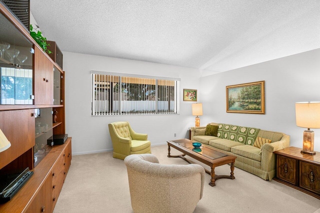 living room featuring carpet floors, healthy amount of natural light, a textured ceiling, and baseboards