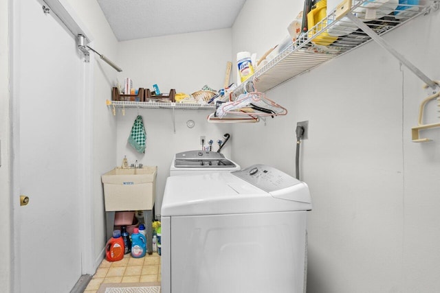 laundry area with washing machine and clothes dryer