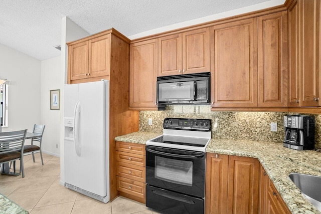 kitchen featuring black appliances, backsplash, light tile patterned flooring, light stone counters, and a textured ceiling