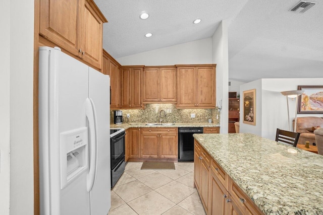 kitchen with black appliances, a sink, light stone counters, backsplash, and a textured ceiling