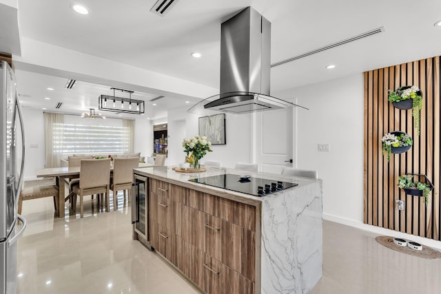 11290 SW 48th St, Miami, FL 33165 - kitchen with modern cabinets, black electric stovetop, island range hood, a center island, and freestanding refrigerator