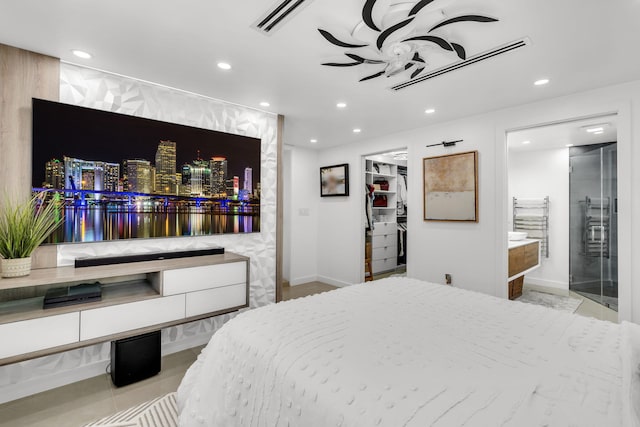 11290 SW 48th St, Miami, FL 33165 - bedroom with recessed lighting, a spacious closet, baseboards, and ensuite bathroom