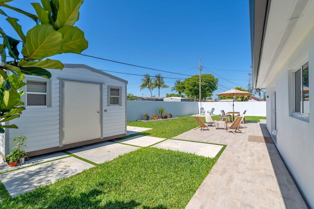 11290 SW 48th St, Miami, FL 33165 - view of yard featuring a shed, a patio area, and an outbuilding