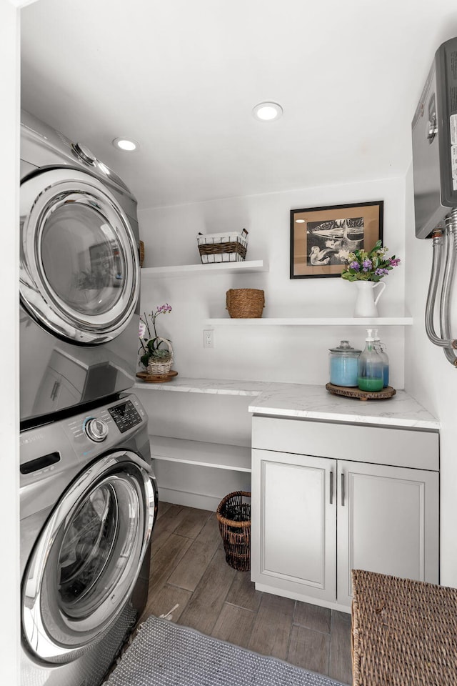 11290 SW 48th St, Miami, FL 33165 - clothes washing area featuring stacked washer and clothes dryer, cabinet space, wood finished floors, and recessed lighting