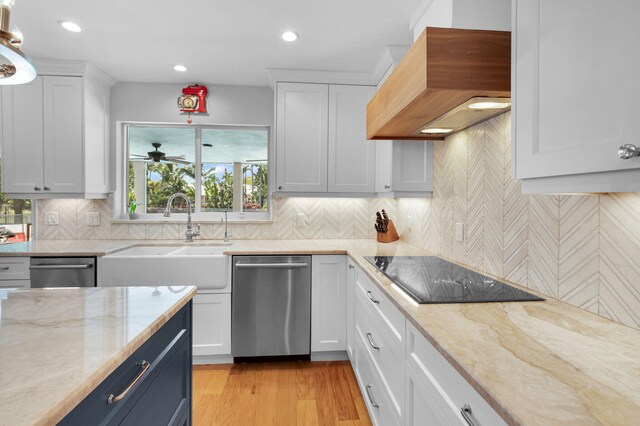 6851 Giralda Cir, Boca Raton, FL 33433 - kitchen with dishwasher, black electric cooktop, custom exhaust hood, a sink, and white cabinets
