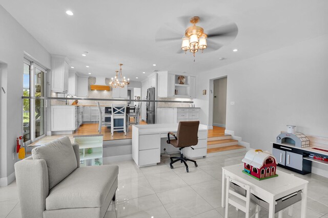 6851 Giralda Cir, Boca Raton, FL 33433 - living area with recessed lighting, ceiling fan, a desk, a chandelier, and baseboards