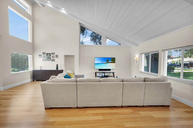 6851 Giralda Cir, Boca Raton, FL 33433 - living room with light wood-type flooring, baseboards, plenty of natural light, high vaulted ceiling, and wooden ceiling