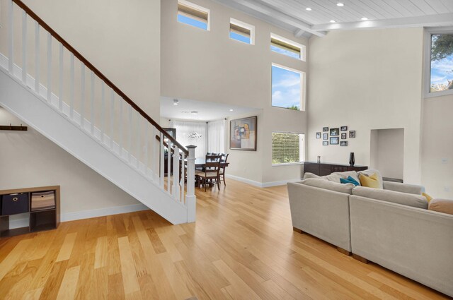 6851 Giralda Cir, Boca Raton, FL 33433 - living room featuring light wood-type flooring, a high ceiling, stairway, recessed lighting, and baseboards