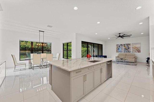 17516 Rainstream Rd, Boca Raton, FL 33496 - kitchen featuring a sink, healthy amount of natural light, recessed lighting, light stone countertops, and decorative light fixtures