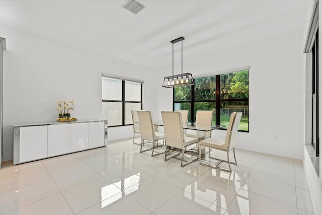 17516 Rainstream Rd, Boca Raton, FL 33496 - dining space featuring a chandelier and light tile patterned floors
