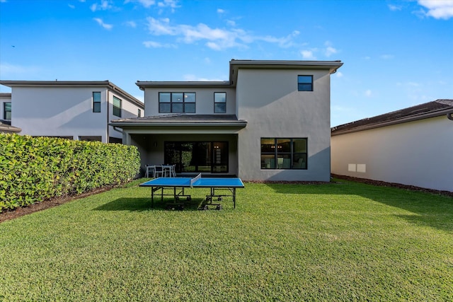 17516 Rainstream Rd, Boca Raton, FL 33496 - rear view of house featuring stucco siding and a lawn