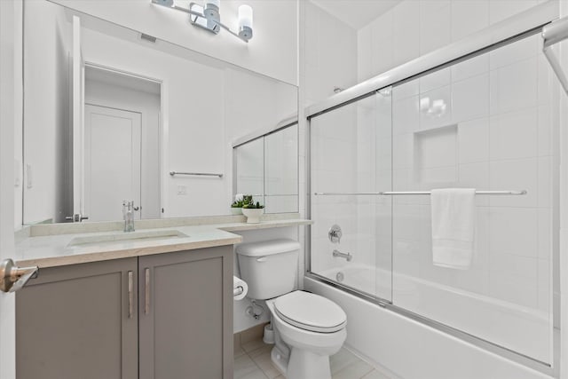 17516 Rainstream Rd, Boca Raton, FL 33496 - bathroom with toilet, vanity, bath / shower combo with glass door, and tile patterned flooring