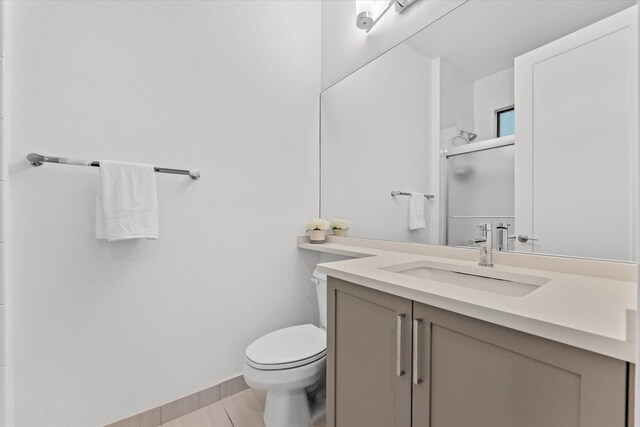 17516 Rainstream Rd, Boca Raton, FL 33496 - full bath featuring toilet, an enclosed shower, vanity, and wood finished floors