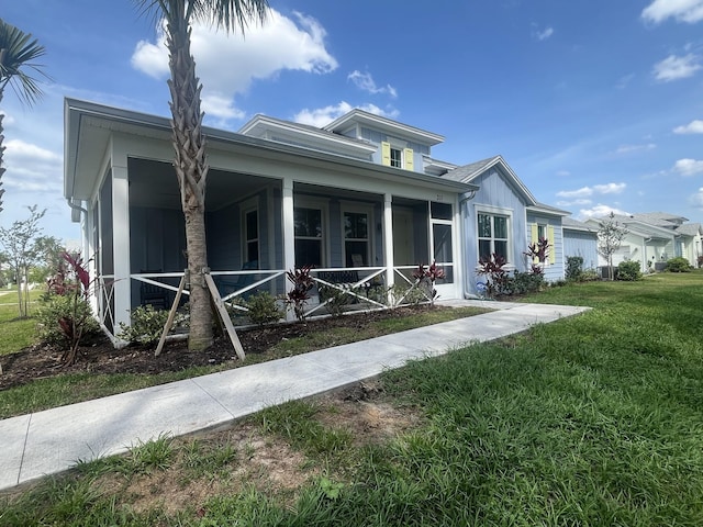 311 Pop Top Ln, Daytona Beach, FL 32124 - ranch-style home with a front yard and covered porch